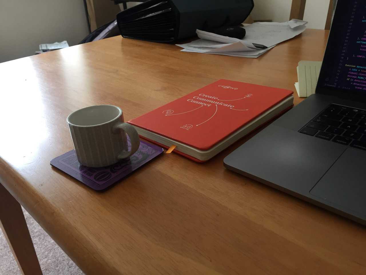 My laptop, coffee mug, and notepad
